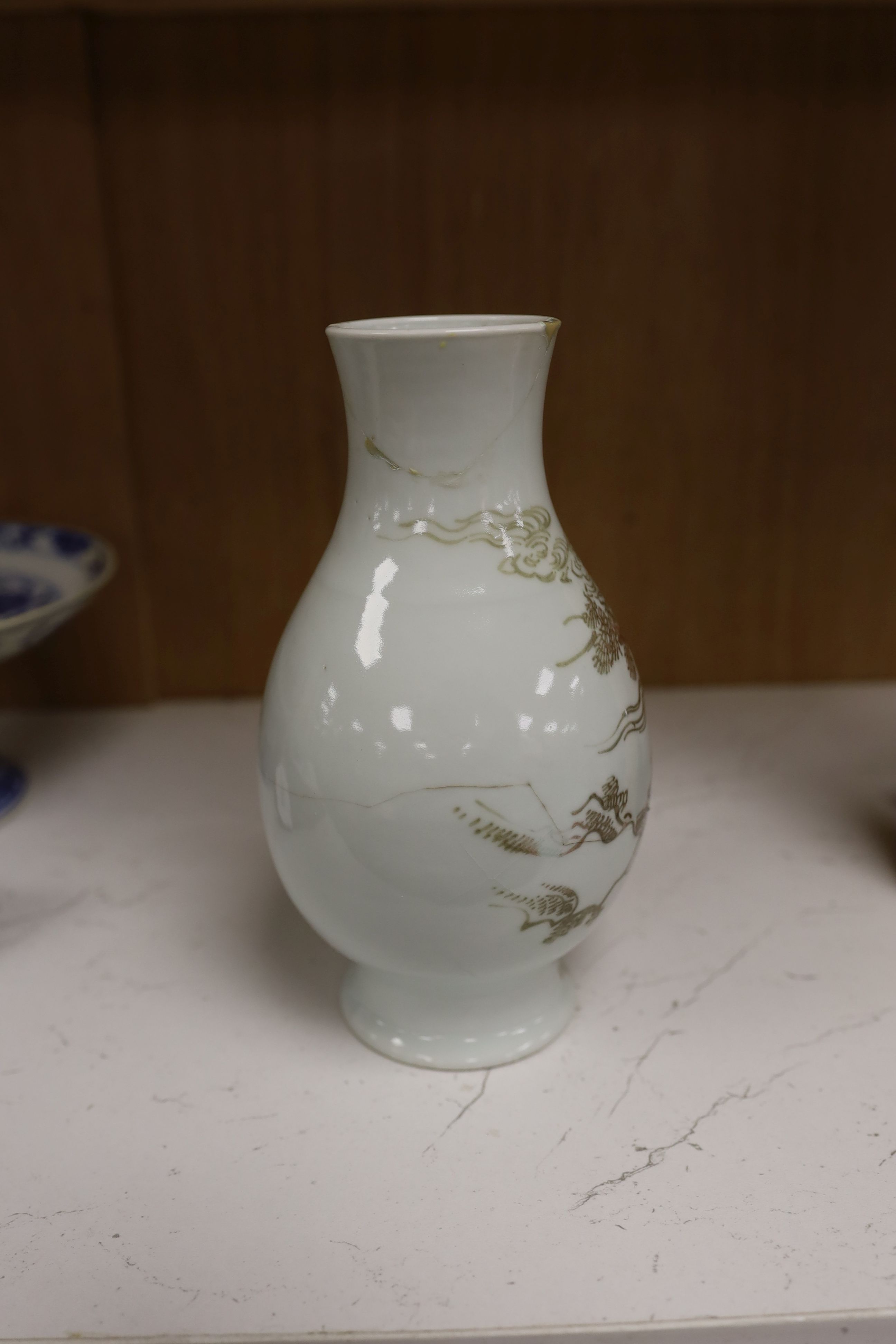 A Chinese underglaze copper red ‘herder and goats’ vase, Kangxi six character mark but Republic period and a Chinese blue and white lotus stem dish, six character Guangxu mark and period, both damaged